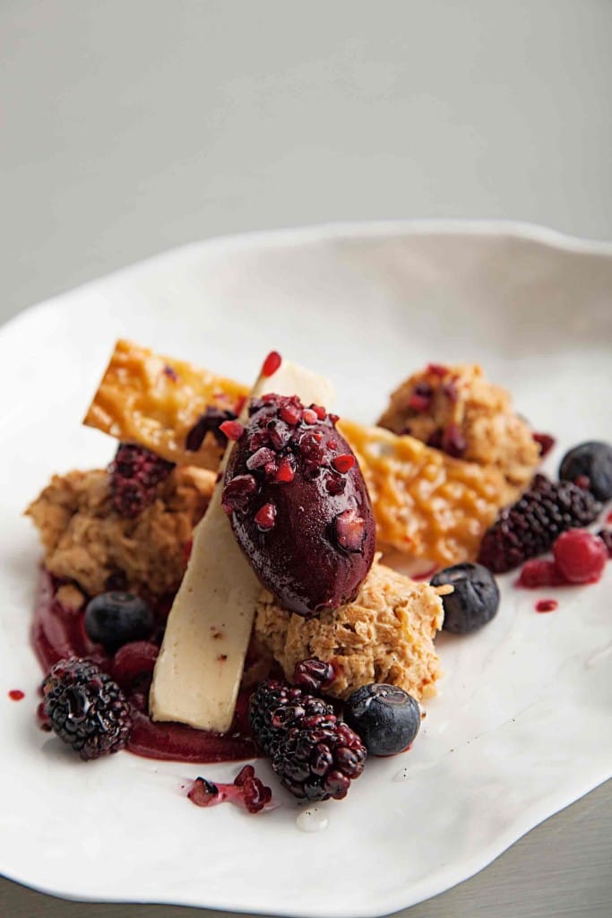 Peanut ice-cream with red fruit and salted peanuts