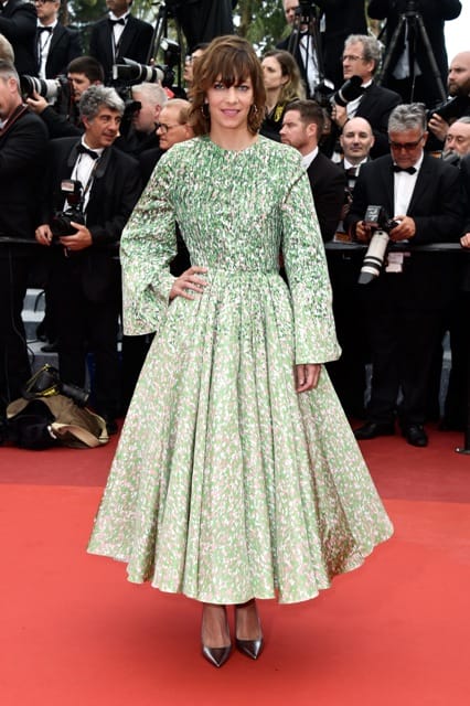 Celine Sallette wore a printed Green white and black silk faille coat-Dior-Haute-Couture Bois de Rose earrings by Dior Fine Jewelry Getty Images for Dior