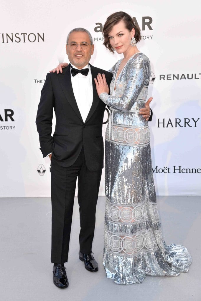 Elie Saab and Milla Jovovich at amfAR the 69th annual Cannes Film Festival