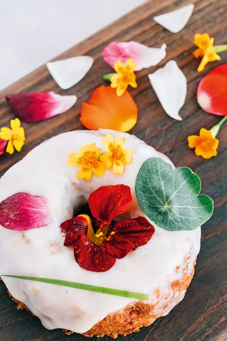 Mid-Summer Garden Cake with edible blossoms at Sidecar Doughnuts