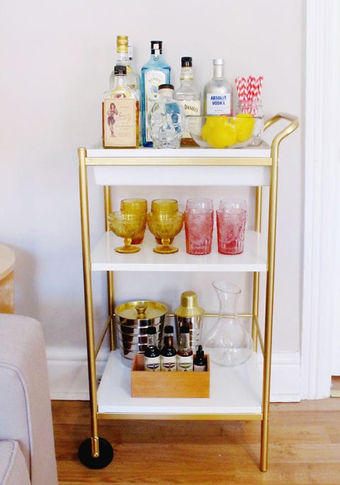 Most glassware you'll find is devoid of color, but taking the time to find a few statement pieces in brighter hues will instantly make your bar cart stand apart from the others. We love the pink and yellow glasses in this bar cart belonging to Leslie Martin of See Love Covet. Photography: Leslie Martin