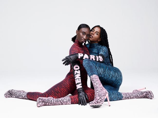 AMY SALL (student and activist, based in New York, founder of SUNU: Journal of African Affairs, Critical Thought + Aesthetics) & JULIANA HUXTABLE (artist, poet and DJ, 28, based in New York) both wear the tiger print jersey rollneck tops and matching high waisted leggings along with long black leather gloves with pink logo rubber print and jacquard knitted tiger-sock shaft boots.