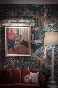 The sitting room at the hotel features custom illustrations of the Bloomsbury Set 