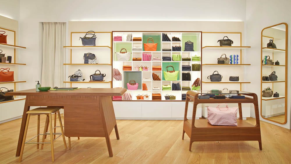 Longchamp new store concept showcasing the library dedicated to Le Pliage handbags.