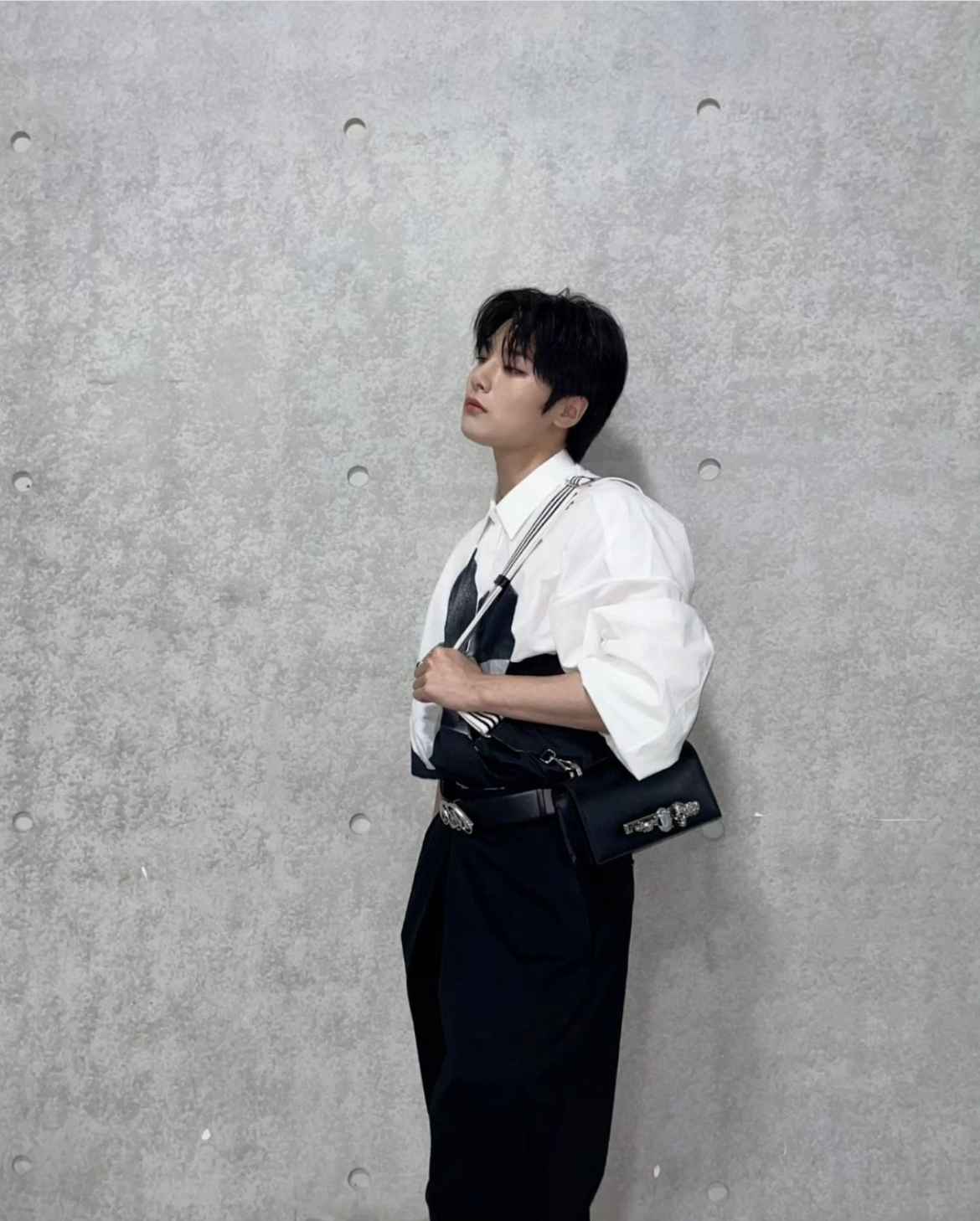 I.N (JEONGIN) FROM STRAY KIDS WEARING THE KNUCKLE SATCHEL