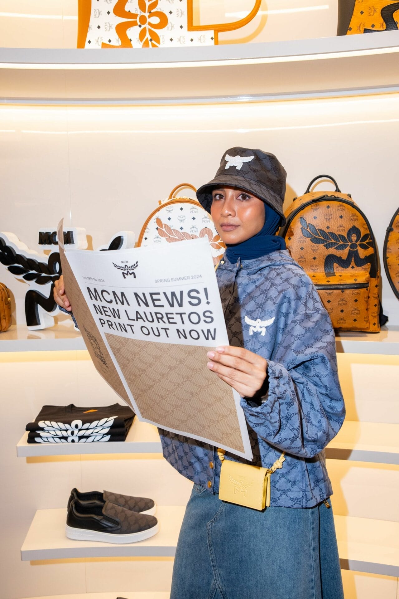 Cik Manggis attending MCM store opening