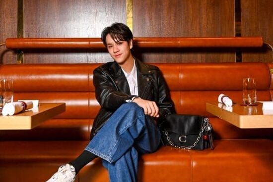 Nanon sits in a New York-inspired restaurant by Coach in Jewel Changi Airport