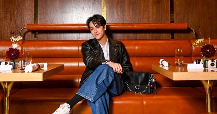 Nanon sits in a New York-inspired restaurant by Coach in Jewel Changi Airport